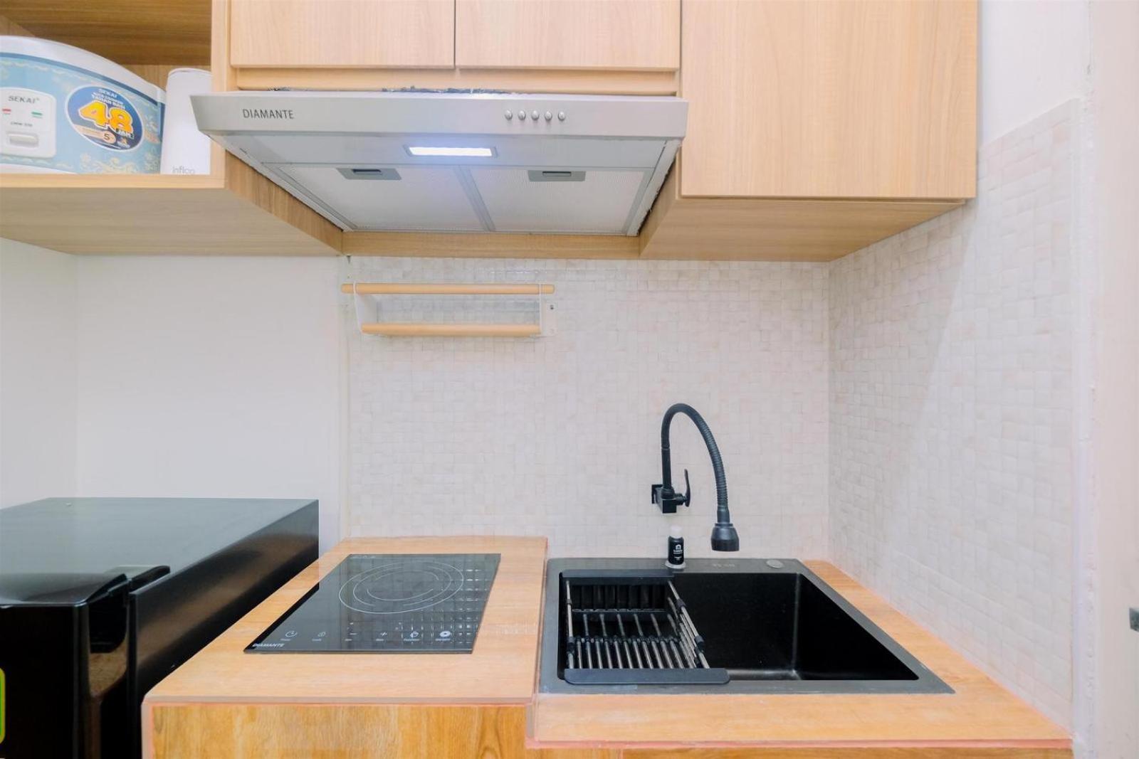 Homey 1br Without Living At Gunung Putri Square By Travelio